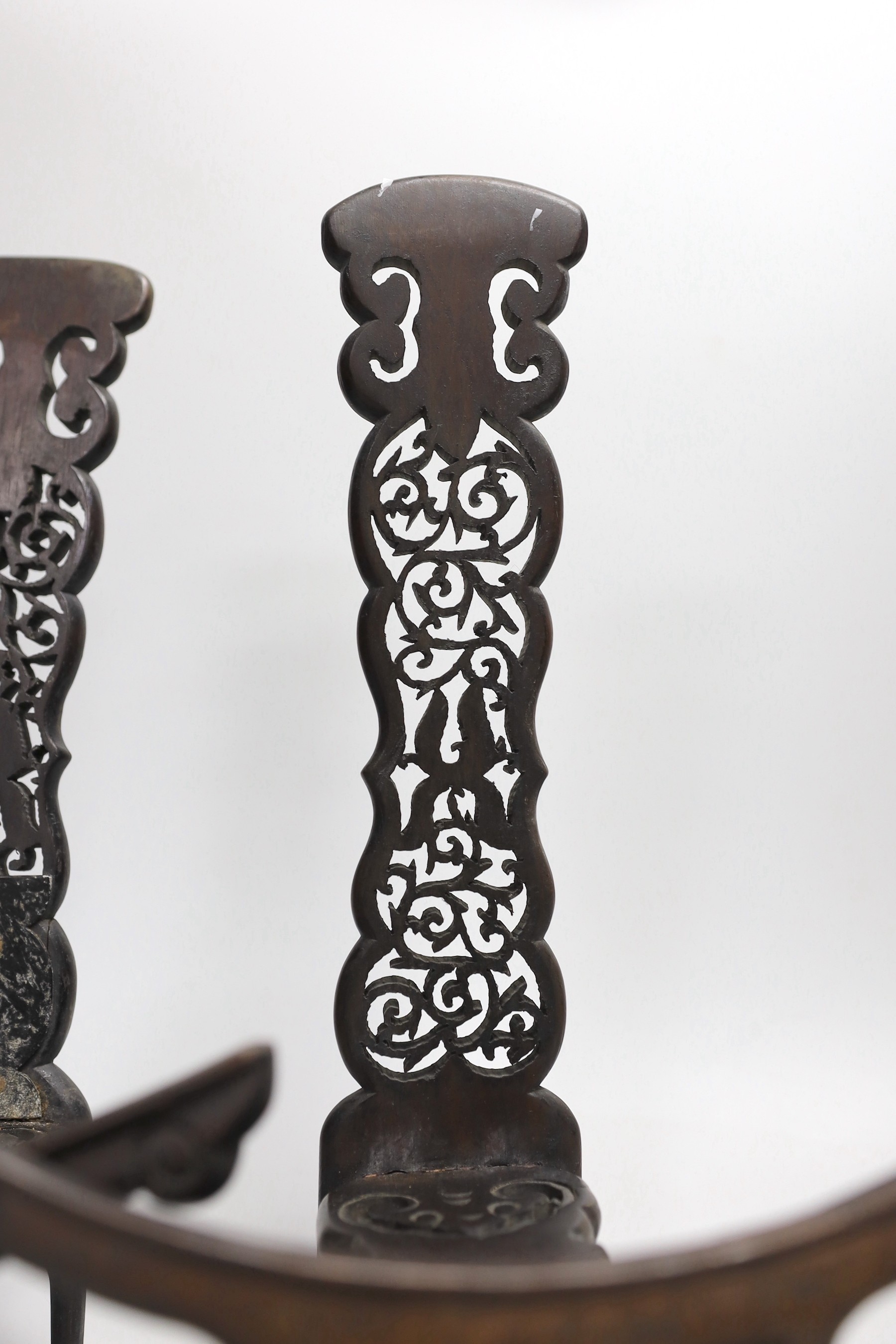 A pair of Chinese carved hongmu dish stands, late 19th century, 32cm tall